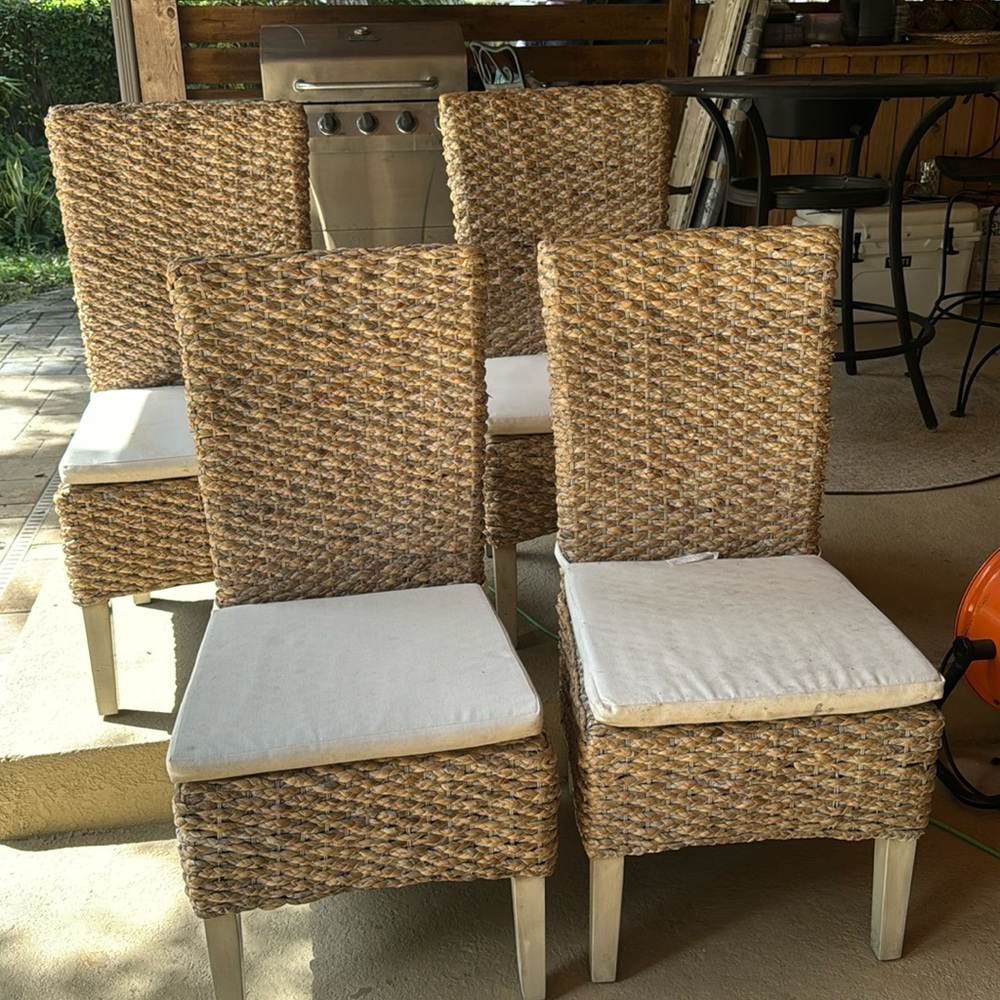 Set of 4 high back rattan dining chairs. Gently used.